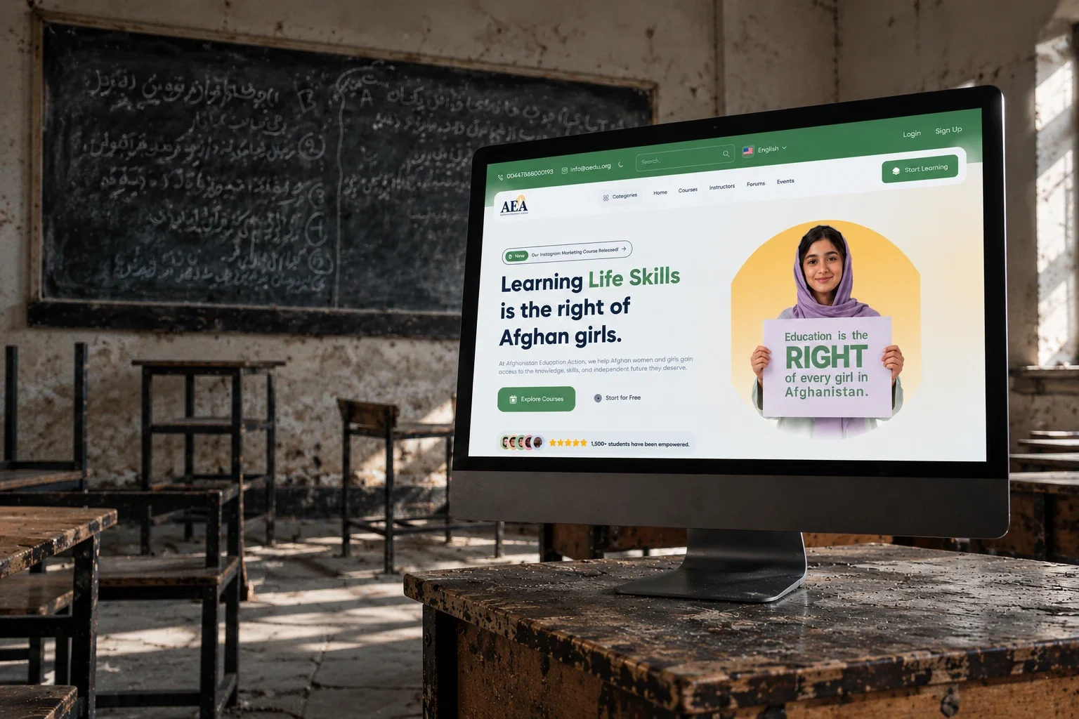 The AEA online learning platform on a computer screen, on a desk in an empty classroom with Persian writing on the blackboard